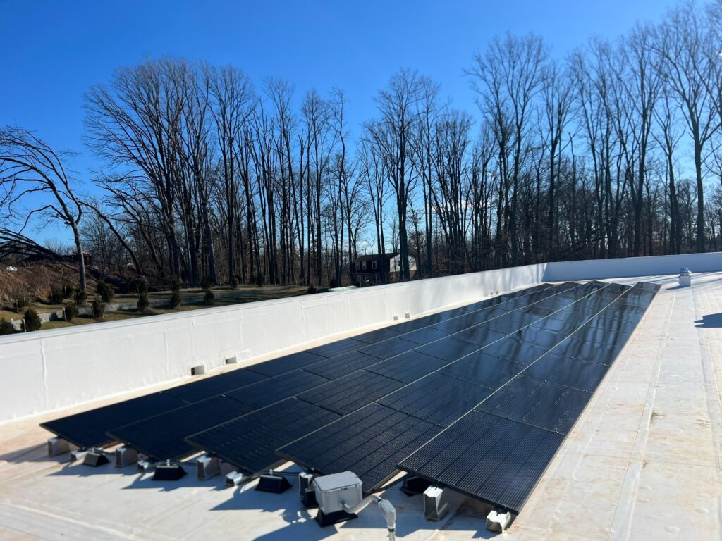 Professional solar panel installer in Cockeysville, MD installing efficient rooftop solar panels